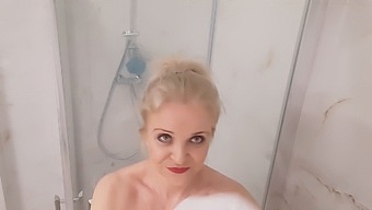 Mature Blonde With Large Breasts Enjoys A Hot Shower