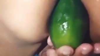 Stepmom Shows Off Her Open Ass While Pleasuring Herself With A Large Cucumber