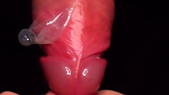 Intense Close-Up Of Babe Milking Cum From Condom With Mouth
